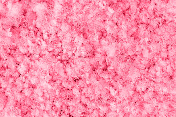 istock Abstract texture pink red Winter background with snow patterns, crystals close-up and snowflakes toned viva magenta color of the year 2023 Natural snow frosty background with copy space 1447409137