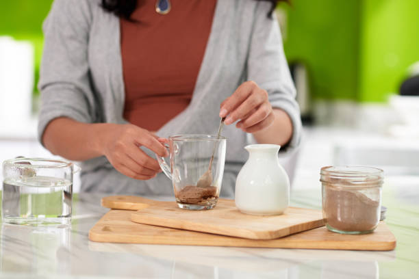 istock Woman Making Hot Chocolate 1447410531