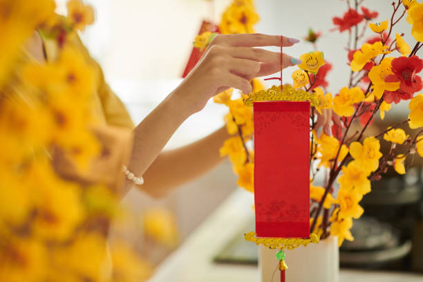 istock Woman Decorating Apricot Branches 1447411209