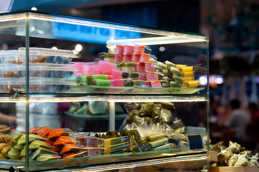 Lot of various multicolored caramel sweets sold at Christmas fair. Colorful lollipops sale in supermarket. Hard candy with inscription \