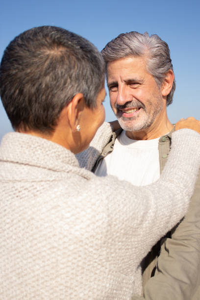 istock Happy senior couple spending time at seashore 1447412318