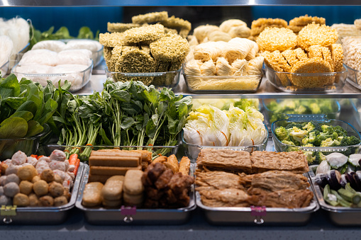 Penang street food stall with various choices of vegetables, fish ball, bean curd and tofu filled with ground meat mixture or fish paste.