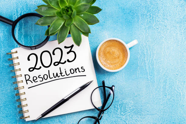 istock New year resolutions 2023 on desk. 2023 resolutions list with notebook, coffee cup on table. Goals, resolutions, plan, action, checklist concept. New Year 2023 background 1447413211