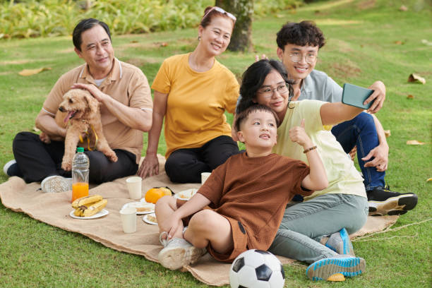 istock Family Selfie in Park 1447413463