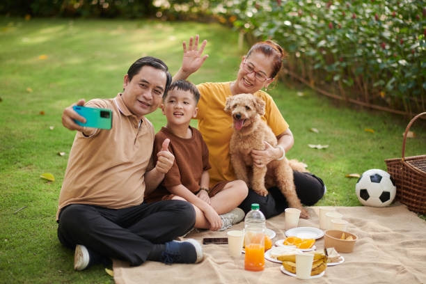 istock Grandparents and Grandson Taking Selfie 1447413510