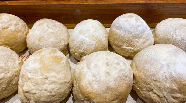 istock sourdough bread on wooden basket. 1447414295