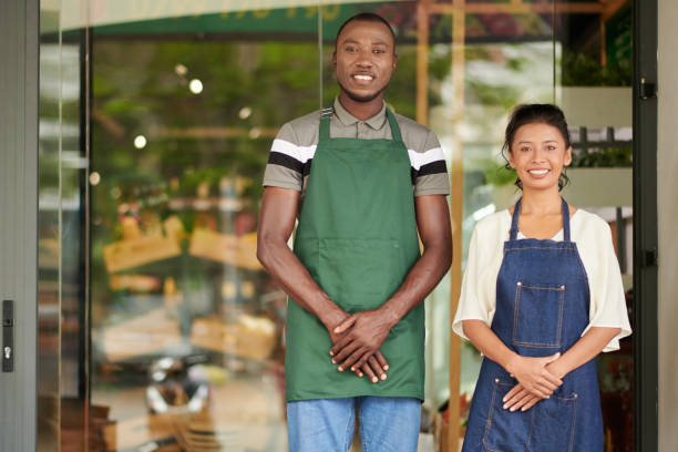 istock Supermarket Workers Standing at Entrance 1447414381