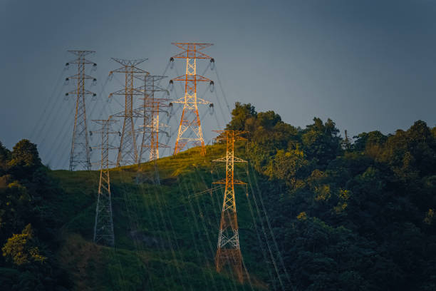 istock Power cable electricity Lyon with hill top with in the sunset 1447414455