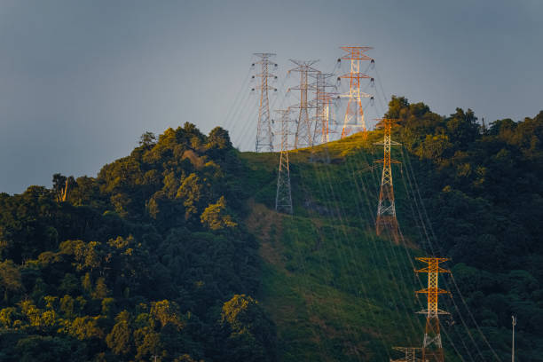 Power cable electricity Lyon with hill top with in the sunset