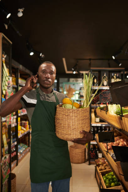 istock Store Worker Collecting Products 1447414609