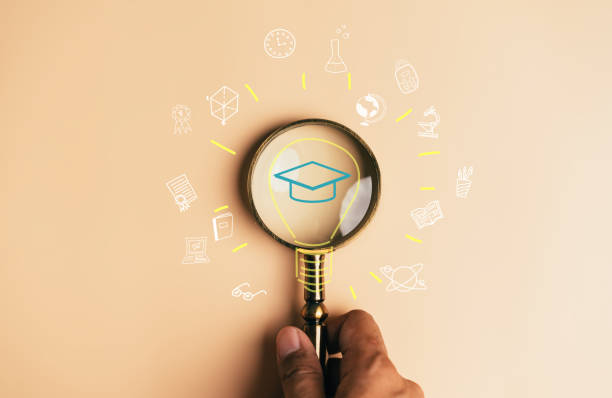 istock Magnifier focus to graduate cap and light bulb icon with learning educate, study knowledge to creative thinking idea and problem solving solution, E-learning online education course degree certificate 1447415997