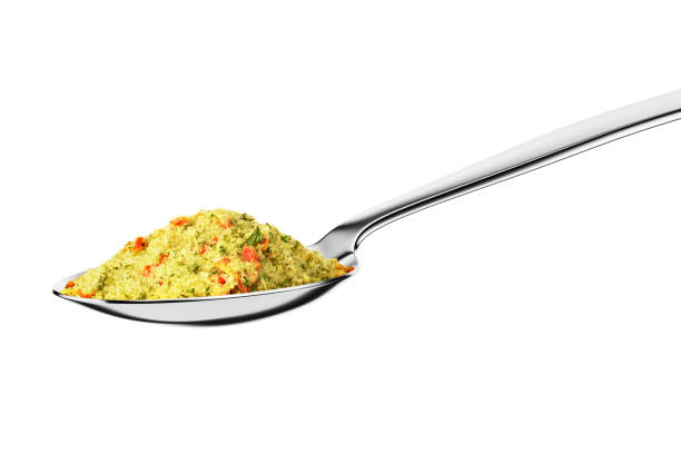 Teaspoon with chicken stock powder isolated on white background.