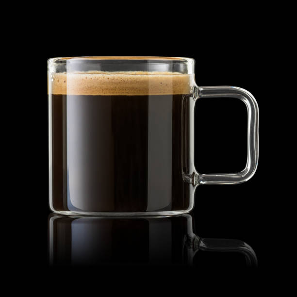 istock Glass cup of espresso coffee isolated on black. 1447419789