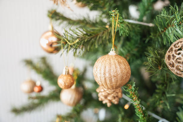 istock Christmas pine tree with decorative golden ball and bauble ornamental 1447420746