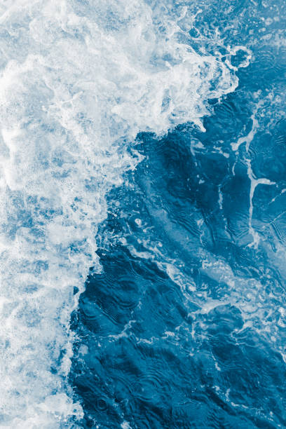 istock Dark blue sea ocean wave and white foam 1447420859