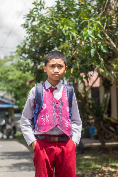 istock Indonesian student with uniform going to school by walking 1447425972