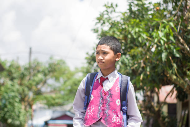 istock Indonesian student with uniform going to school by walking 1447426639