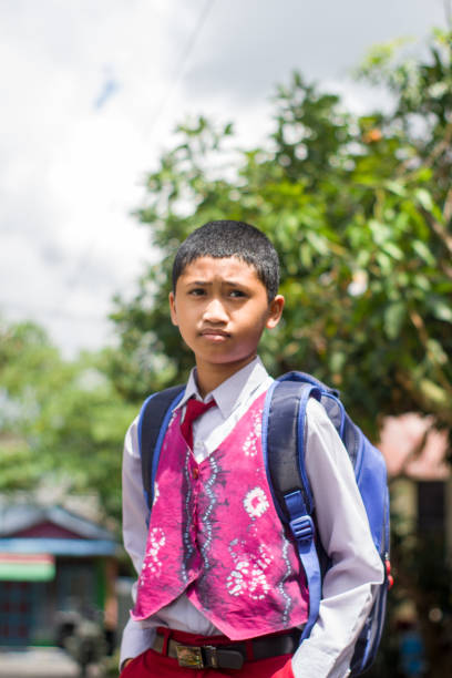 istock Indonesian student with uniform going to school by walking 1447426674