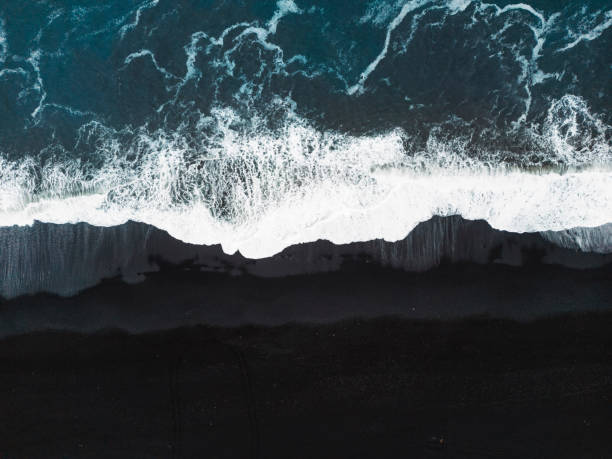 istock Directly above waves crashing on the black sand beach 1447426861