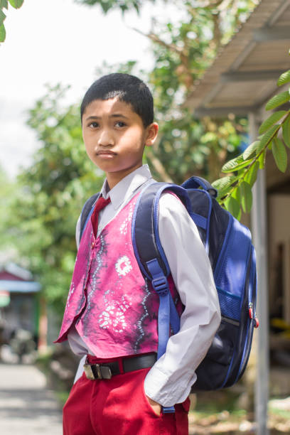 istock Indonesian student with uniform going to school by walking 1447427394