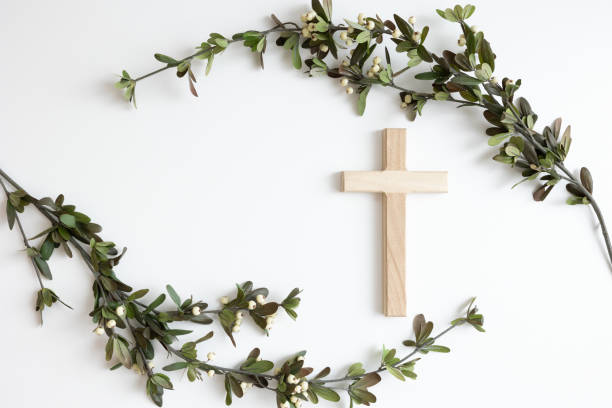 Wood cross and branches with white berries