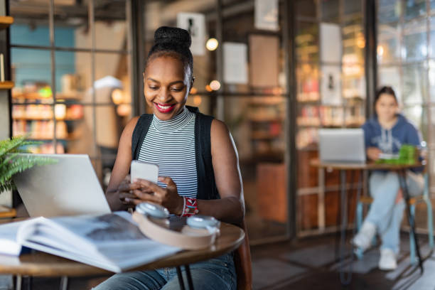 istock Young female student looking at mobile phone 1447427558