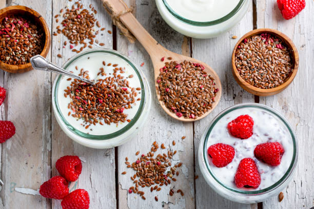 Mixture of seeds, raspberries and yoghurt stock photo