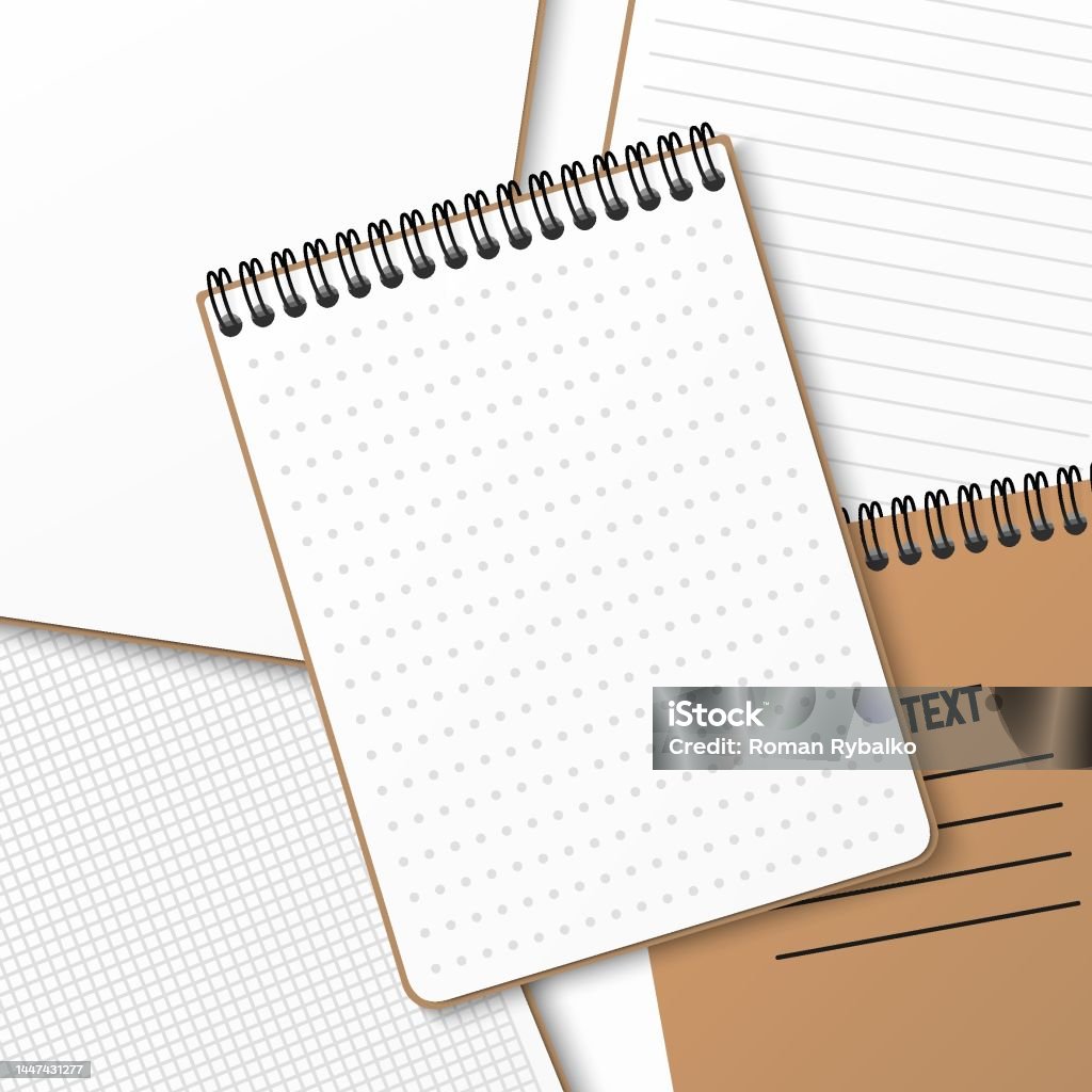 A Notebook With A Horizontal Spring Coil Lies On Top Of Another ...