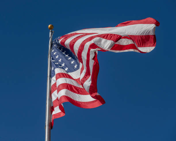 istock A Large American Flag Blows in the Wind 1447434426