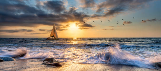 Sailboat Sunset Inspirational Ocean Sailing Banner stock photo