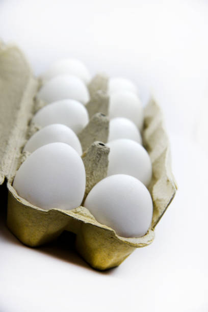 istock Fresh white chicken eggs in a paper bag. White eggs in a package on a white background. Eggs from the store. 1447450081