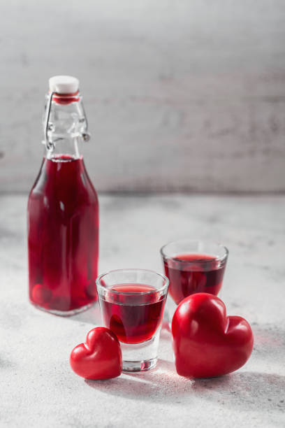 istock Red cocktail, vodka or liqueur and Heart shape decorations 1447450894