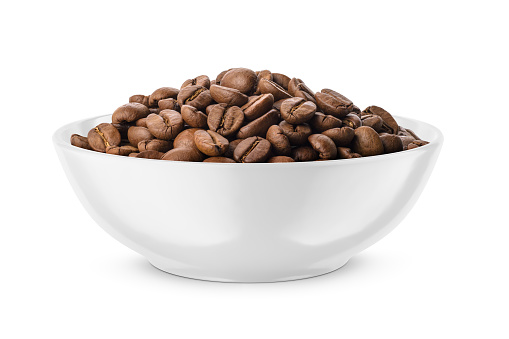 Roasted coffee beans in white bowl isolated on white background. Front view.