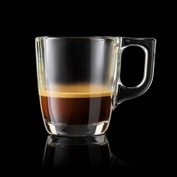 istock Glass cup of espresso coffee isolated on black. 1447454640