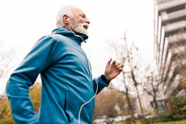 istock Mature man running in public park 1447457866