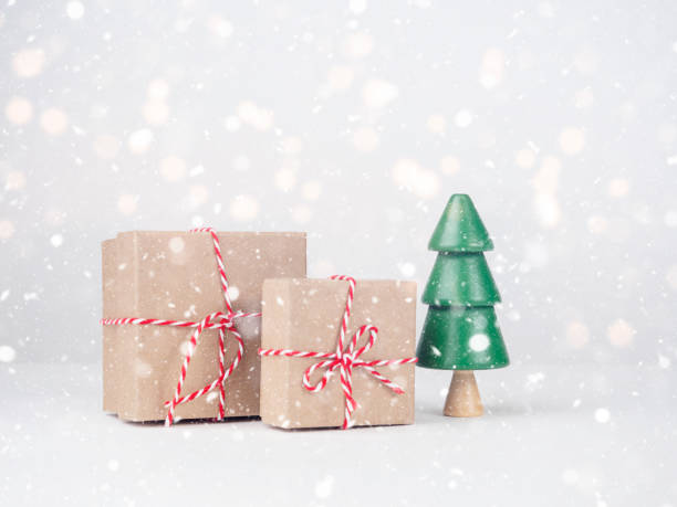 istock Christmas tree with boxes on a light background. New Year's Eve, Christmas and presents concept. 1447457917