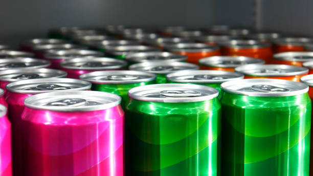 Close-up of many colorful cans standing in a rows stock photo