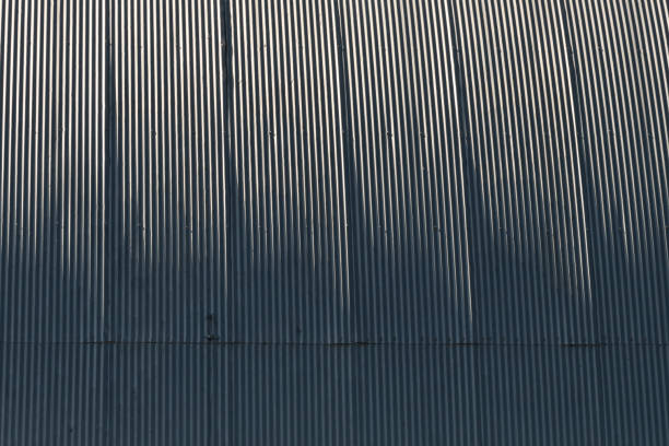 istock Gray corrugated metal wall up close, abstract, background. 1447459077