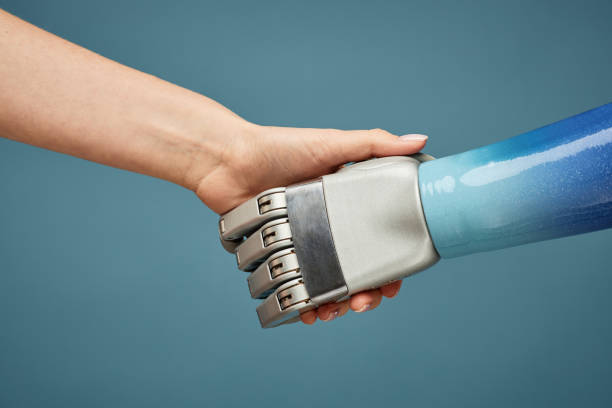 istock Person Shaking Hand of Robot 1447461354
