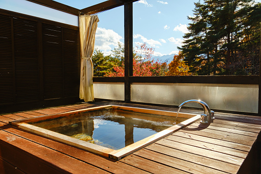 An outdoor wooden bathtub in rural Japan.