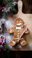 istock Prepapring Christmas gingerman cookie cake  home social media vertical tutorial taken on mobile device 1447462202