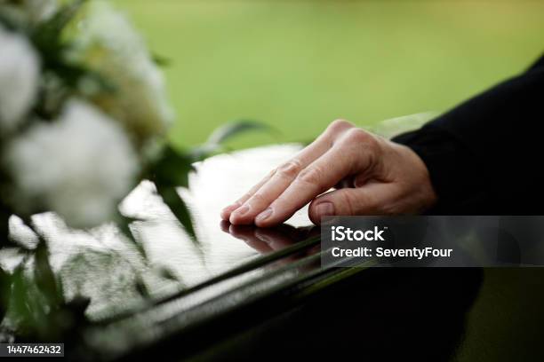 Closeup Of Womans Hand On Coffin Stock Photo - Download Image Now - Funeral, Coffin, Mourner
