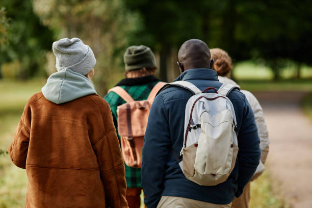 istock Back view of two couples enjoying walk 1447463125