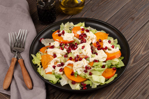istock Salad with persimmon and pomegranate 1447463322