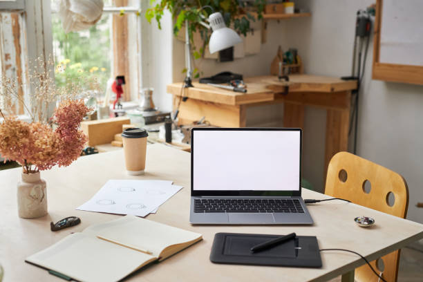 istock Background of open laptop on designers workplace 1447463779