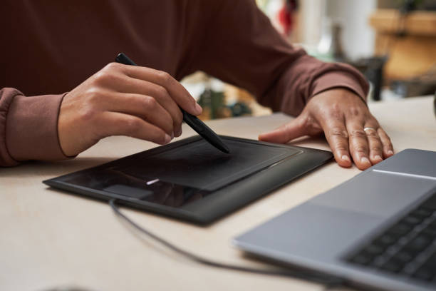 istock Close up of black female artist using graphic tablet 1447463799