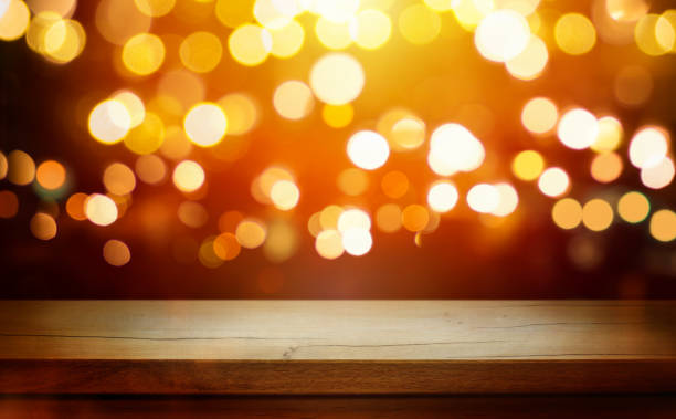 istock Christmas Bokeh Background - rustic wooden table and Magic golden blurred holidays lights - Backdrop for product presentation 1447464324