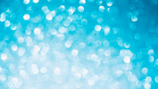 istock Shiny light blue blurred background for holiday design. Christmas banner abstract textured glitter, selective focus 1447467147