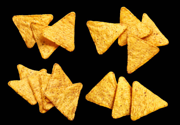 istock Collection of nachos chips on black background 1447470515