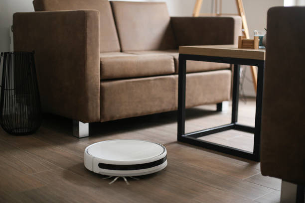 istock Robot vacuum cleaner cleaning a room 1447475169